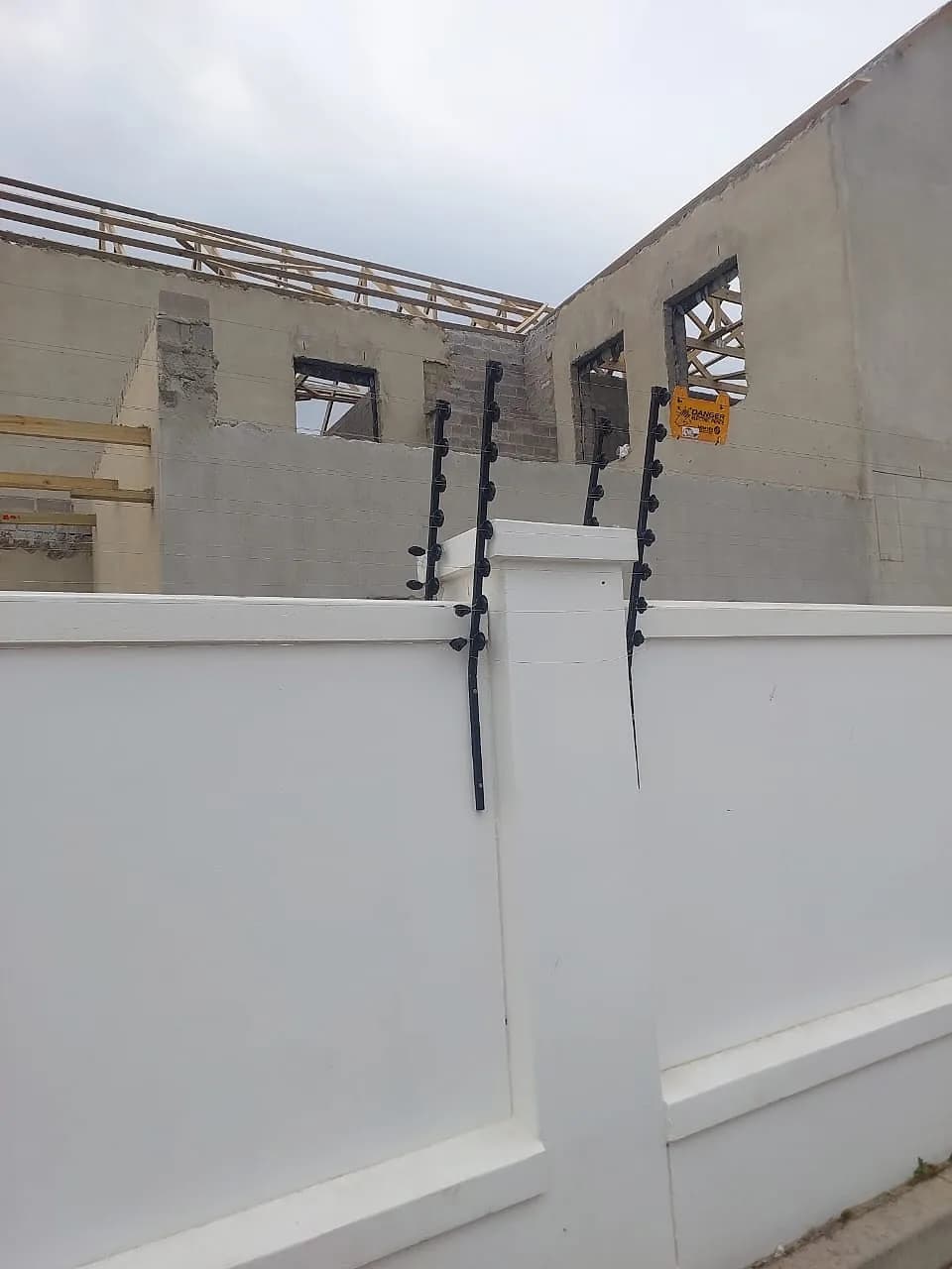 White painted boundary wall on a new build