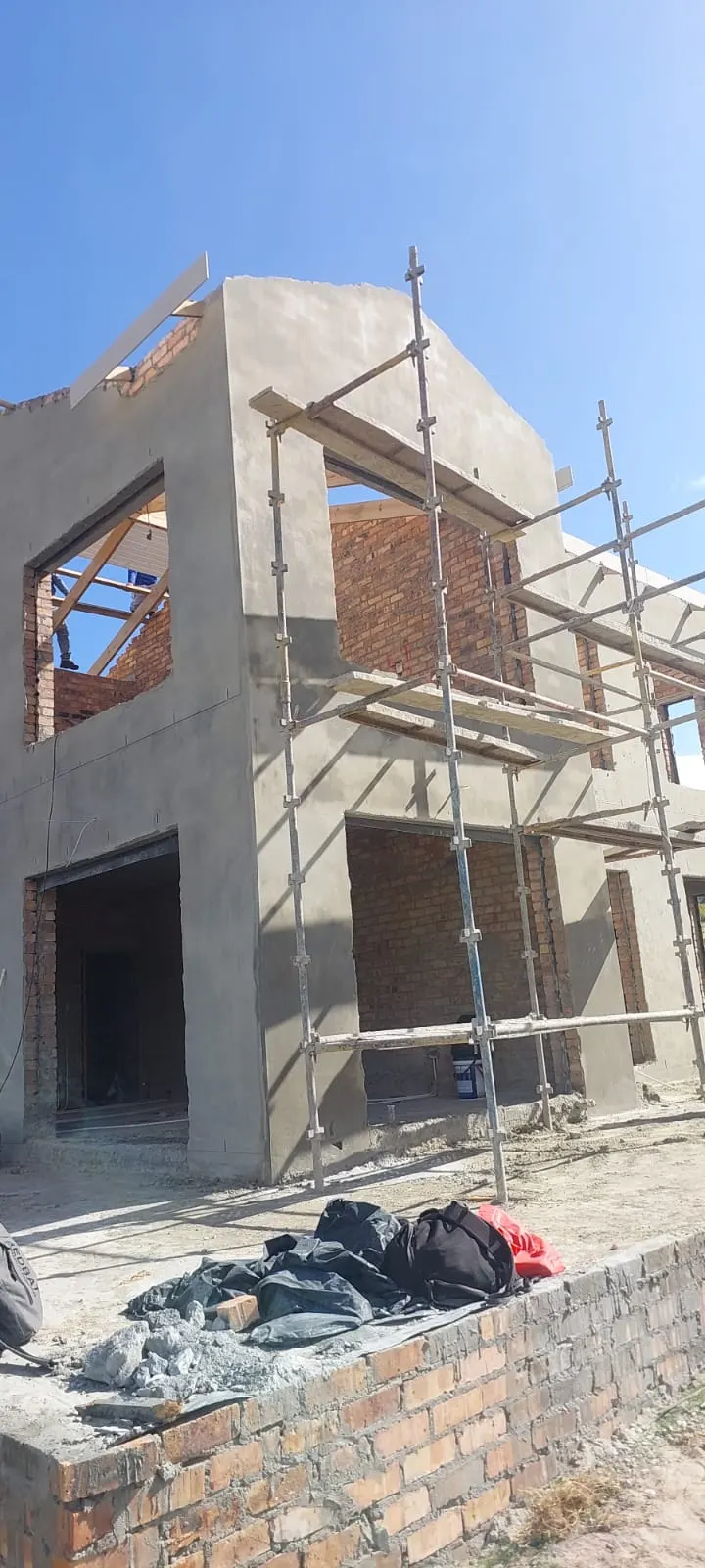 Scaffolding erected for plaster repairs before exterior painting
