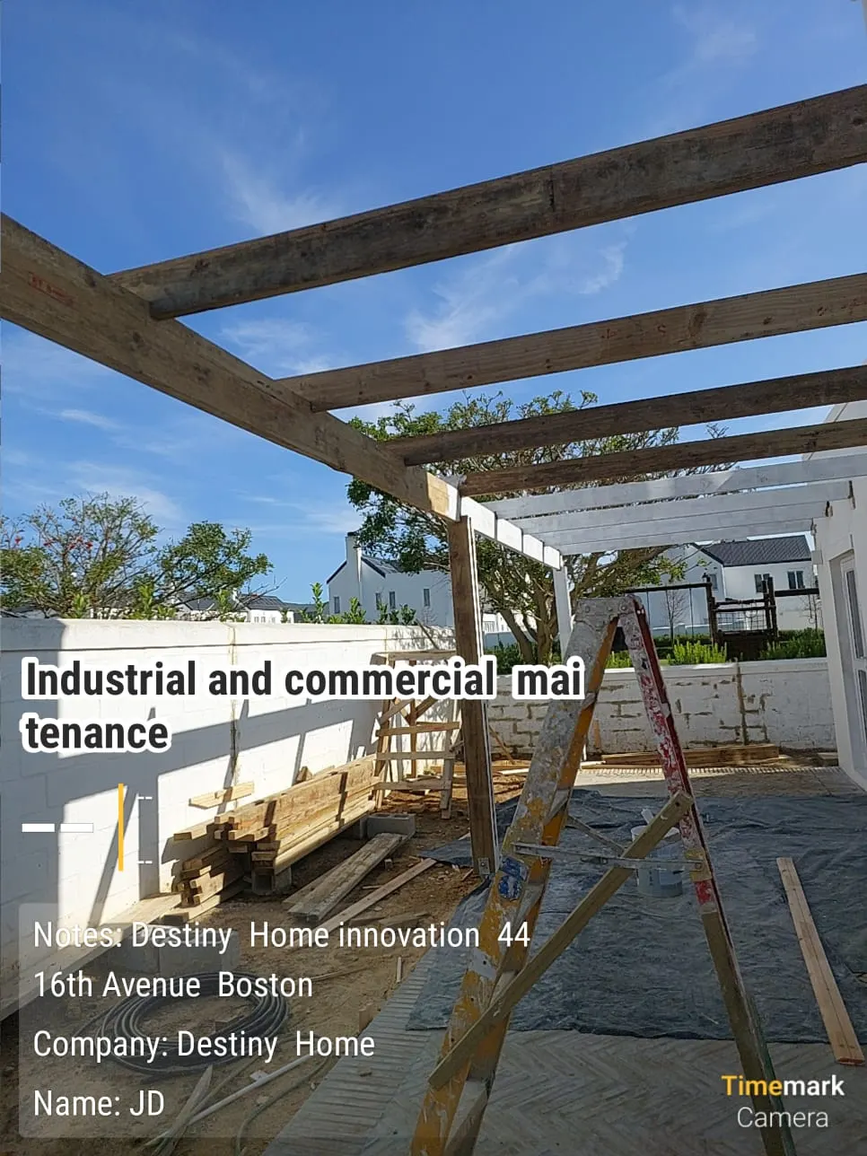 Pergola timber beams being treated and sealed