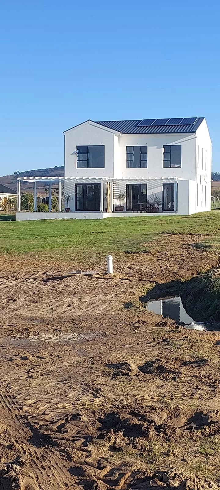 Freshly painted white double storey home with mountain views in the Western Cape